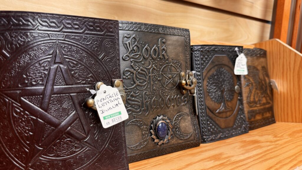 Leather-bound journals with embossed covers on display at New Visions Books and Gifts.